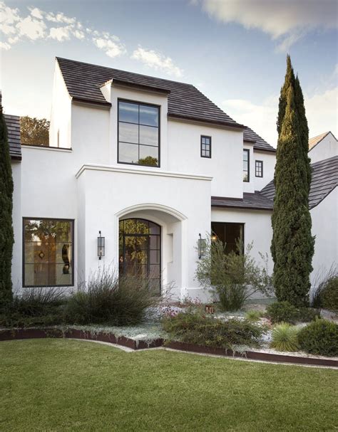 white stucco house with black metal roof|white stucco house designs.